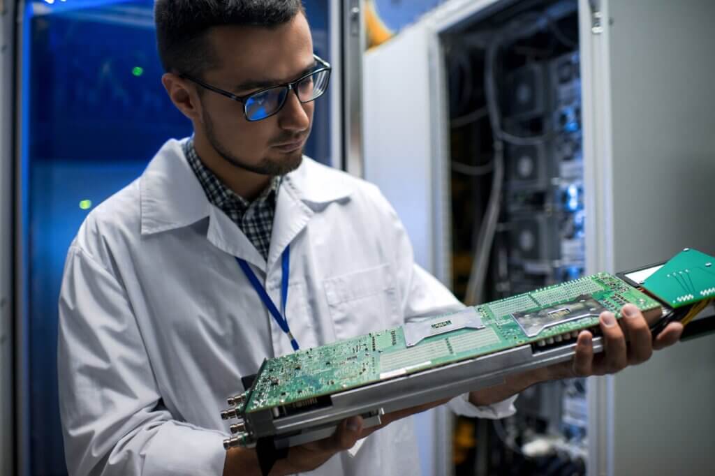 Scientist Inspecting Supercomputer